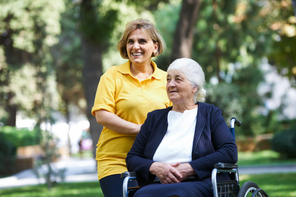 professional,helpful,caregiver,and,handicapped,senior,woman.,daughter,cares,for