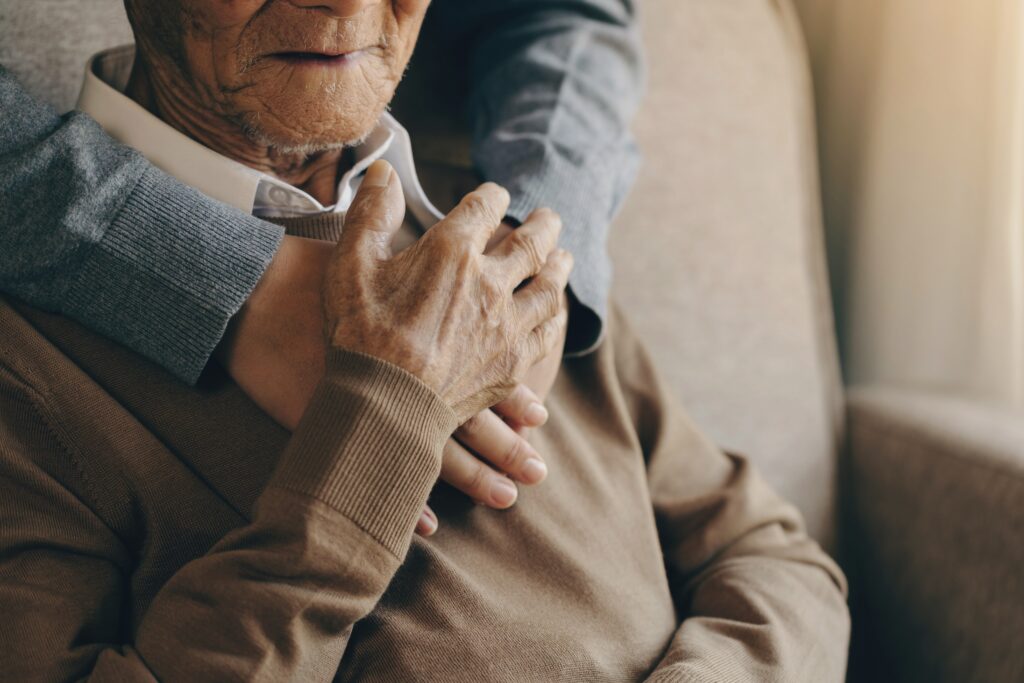 happy,healthcare,worker,hugging,a,senior,man,at,home,and